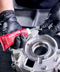 Person applying Head Bolt And Water Jacket Sealant For Automotive Engines With OEM Approved Performance Provides Lubrication