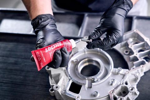 Person applying Head Bolt And Water Jacket Sealant For Automotive Engines With OEM Approved Performance Provides Lubrication