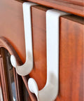 Over The Door Hook Set White Plastic Hanger For Coats Towels And Accessories Easy Install Door Mount Rack, shown on wood door