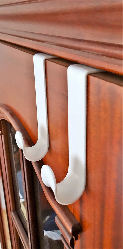 Over The Door Hook Set White Plastic Hanger For Coats Towels And Accessories Easy Install Door Mount Rack, shown on wood door