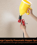 Top Shelf Pneumatic Texture Sprayer Hopper Gun With 0.8 Gallon Hopper Tank and Three Rugged Swappable Nozzles mounted, spraying texture.