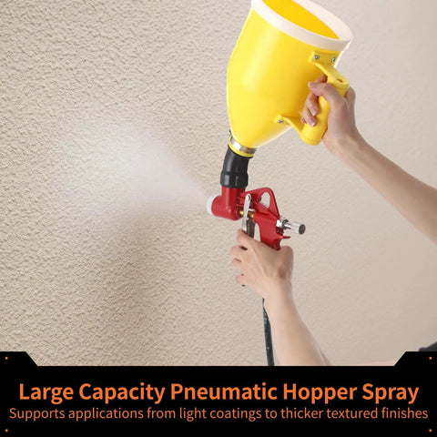 Top Shelf Pneumatic Texture Sprayer Hopper Gun With 0.8 Gallon Hopper Tank and Three Rugged Swappable Nozzles mounted, spraying texture.