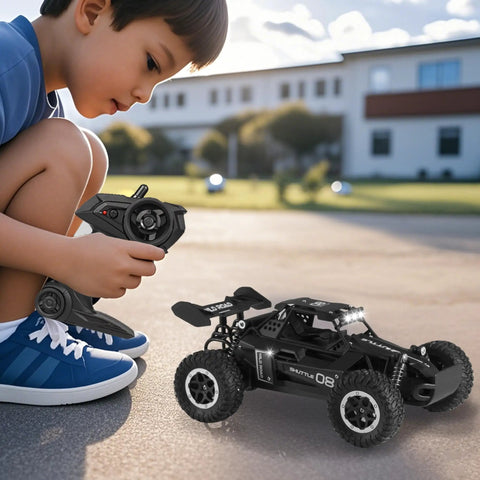 Boy playing with One Sixteenth Scale All Terrain RC Monster Truck With LED Headlights 2WD Off Road High Speed Remote Control Car, outdoors.