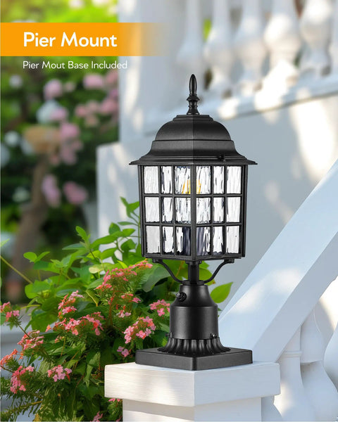 Outdoor Dusk To Dawn Post Light With A 3 Inch Pier Mount Base 19 Inch Tall Exterior Lantern Featuring Tempered Glass Anti Rust Die Cast Aluminum Construction Matte Black Hardwired 120V Lamp Post For Homes And Driveways on railing, surrounded by flowers.