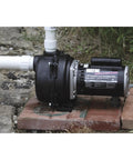 2 HP Cast Iron Lawn Sprinkling Pump With High Volume Output For Outdoor Irrigation And Garden Watering installed on bricks