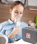 Child using nebulizer next to a Travel Ready Hard Shell Medical Case For Portable Nebulizer And Inhaler Accessories.