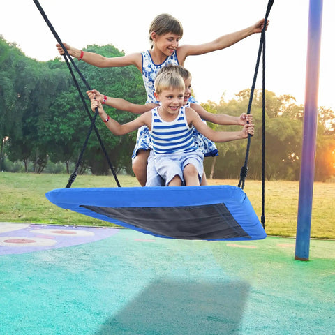 Children enjoying 60 Inch Rectangle Tree Swing With 700 Pound Capacity Open Flat Platform Heavy Duty Waterproof For Kids And Grownups Includes Installation Kit And 2 Tree Straps Blue in park