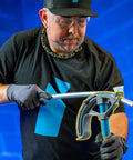 Heavy Duty 3/4 Inch Emt Guardian Bender With Handle adjustable angle stopper in use for bending electrical conduit pipe.