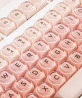 Clean 80 Percent Wireless Mechanical Keyboard In Soft Pink Creamy Build Featuring Jelly Moa Profile Transparent Keycaps close-up view