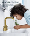 Child washing hands under Brushed Gold Bathroom Sink Faucet, 8 Inch Widespread, 3 Hole, Two Handles, 360 Degree Swivel Spout, Lead Free Brass