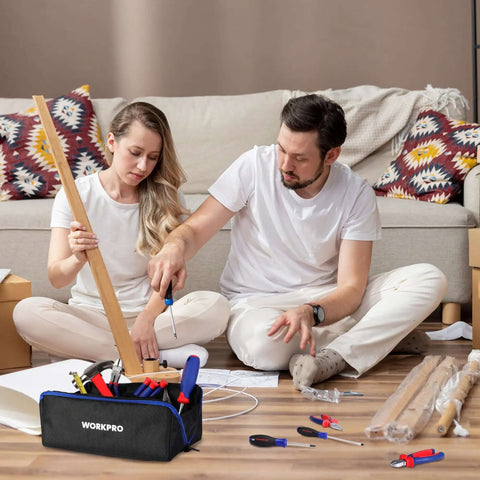 Couple using tools with Heavy Duty 10 Inch Tool Bag With Zipper Wide Mouth Pouch Organizer 3 Pack, 1680D Oxford Cloth, on floor.