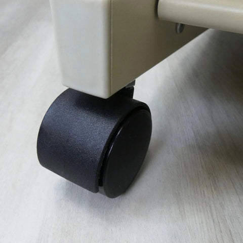Side view of black 2-inch twin-wheel office chair caster mounted on a chair leg.