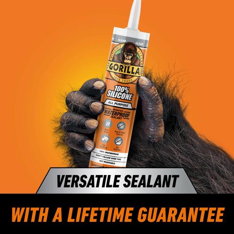 Gorilla 100% silicone sealant cartridge, all-purpose, 10 oz, clear with orange label, held by a gorilla hand