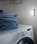 Laundry room with Wireless LED Light Switch Tap Light Battery Powered 100 Lumens Peel And Stick Portable Lighting on wall.