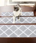 Cat on wooden stairs with Non Slip Stair Runners For Pets And Kids Indoor 28 By 9 Inch Stair Mats With TPE Backing 13 Piece Gray Set