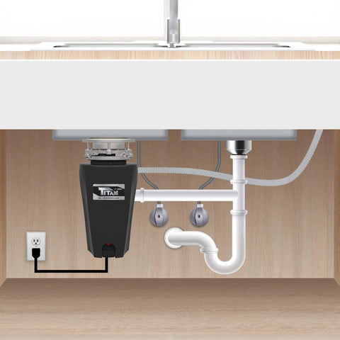 Installed Gutsy Half HP Garbage Disposal With Torque Master Grinding System in black under kitchen sink