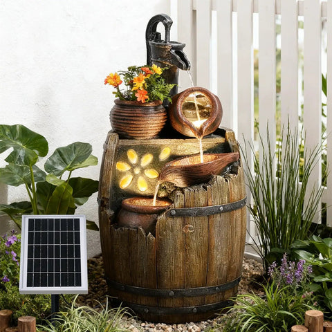 Solar Powered Rustic Barrel Water Fountain With LED Lights, 29 Inch Tall 4 Tier Cascading Outdoor Waterfall in a garden setting.