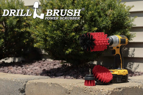 Drill Powered Outdoor Cleaning Brush Kit For Patio, Deck, Concrete And Gutters with red stiff brush, next to a drill