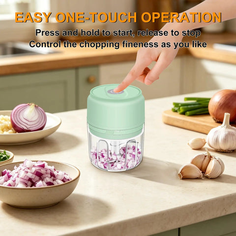 Chill Out With This Tiny Wireless Garlic Chopper That Zips Mini Food Processing, compact mint green garlic mincer in use chopping onions.