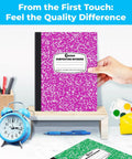 Hand holds pink notebook from 100 Pack Wide Ruled Composition Notebooks With Hard Covers, 200 Pages Each, Assorted Marble Colors
