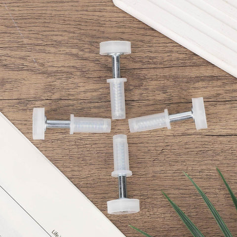 Four Pack Bi Fold Door Top Roller Guide Wheel And Pivot Kit with Seven Eighths Inch Spring Loaded Top Pivots on wooden surface