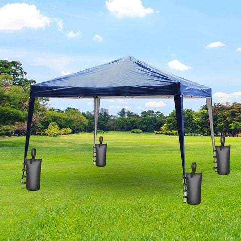 Blue canopy tent in park secured by 4 Pack Beefy 210 Pound Sandbags With Zippers And Straps For Beach Canopies Pop Up Tents