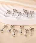 Stainless Steel Earring Set For Women, 10 Pairs, Includes Small Huggie Hoops, CZ Studs, And Glossy Spherical Studs, Versatile Stainless Steel Jewelry For Everyday Piercing Looks. Front view of 316L steel CZ and ball stud earrings