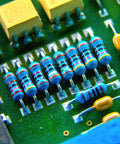 Close-up of a PCB with 1/4W Metal Film Resistor Assortment Kit With Fifty Values From 0 Ohm To 10 M Ohm, One Percent Tolerance, Common Fixed Resistors