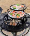 Close-up of 42 Inch 3 In 1 Fire Pit With Two Grills Lid And Tabletop Heavy Duty Outdoor Wood Burning Fire Pit with food grilling