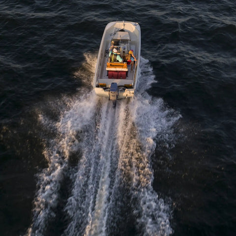 Boat on water with Portable 12 Gallon Marine Gas Can With Built In Fuel Gauge And Pick Up Cap 2 Way Vented Cap Easy To Carry Handles EPA And CARB