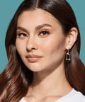 Woman wearing lashes applied with Super Strong Black Lash Glue For Strip Lashes And Clusters With Biotin And Blueberry Extract
