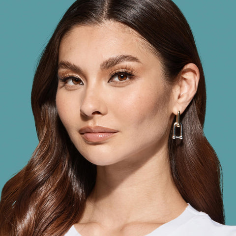 Woman wearing lashes applied with Super Strong Black Lash Glue For Strip Lashes And Clusters With Biotin And Blueberry Extract