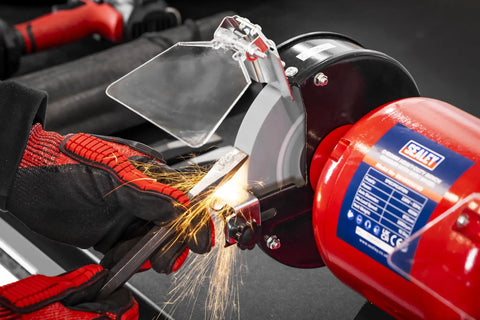Workhorse 150Mm Bench Grinder Equipped With A Beefy 450W Induction Motor dual grinding wheels in action sharpening tools.