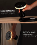 Rechargeable LED Table Lamp With Wireless Charging Pad Dimmable Night Light in hand, showing magnetic docking system.