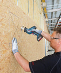 Professional Grade Cordless Saber Saw Delivering Smooth Operator Performance And Badass Cutting Power For Heavy Duty Renovations And Real Deal Work On Any Job Site cutting through OSB with precise control.