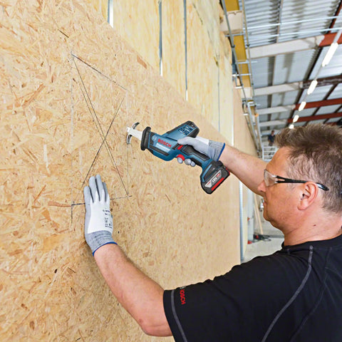 Professional Grade Cordless Saber Saw Delivering Smooth Operator Performance And Badass Cutting Power For Heavy Duty Renovations And Real Deal Work On Any Job Site cutting through OSB with precise control.
