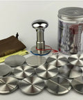 58.35 Mm Espresso Coffee Tamper Kit With Stainless Steel Base And Silver Mirrored Aluminum Handle Comes With Hella Tough Silicone Mat Plus Travel Pouch shown with various metal discs.
