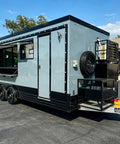 Custom Rollout Food Trailer Kitchen Unit Featuring Heavy Duty Refrigerator Commercial Sink And Stainless Steel Juicer Station with open side.