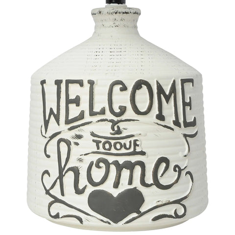 White wash ridged ceramic base with 'Welcome Home' design from Welcome Home Rustic Ceramic Farmhouse Table Lamp With White Linen Shade