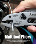 Close-up of Five In One Portable Multitool Pliers Set With Cross Wrench, Screwdriver, Knife And Protective Cover used on a bike cable.