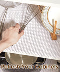 Top Shelf Nonslip Shelf Liner For Kitchen Cabinets And Drawers, White Non Adhesive Mat, 12 X 120 Inches with kitchen tools and plates.