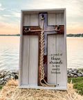 All Purpose Twisted Sisal Rope That Is Tough As Nails For Crafts Diy Gardening Decor And Outdoor Use Natural Thick Twine Water Resistant And Built To Last Comes In Multiple Lengths For Indoor Or Outdoor Jobs displayed on a wooden cross by a lake.