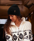 Woman wearing Unisex Cuffed Beanie Thick Double Knit Winter Skull Cap Black Cozy Warm For Skiing Running And Daily Cold Weather Protection Ultra Soft No Itch Comfort
