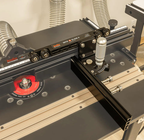 Miter Slide II Precision Miter Slot Accessory on router table, dual aluminum tracks, heavy duty locking handle, extruded aluminum