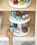 Game Changer Two Tier Height Adjustable Lazy Susan Turntable With Smooth 360 Swivel For Kitchen Cabinet And Pantry Organization And Quick Access Storage In White, featuring spices and condiments.