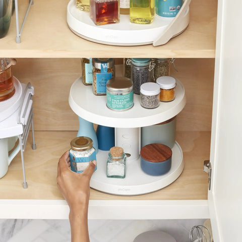 Game Changer Two Tier Height Adjustable Lazy Susan Turntable With Smooth 360 Swivel For Kitchen Cabinet And Pantry Organization And Quick Access Storage In White, featuring spices and condiments.