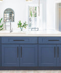 Blue kitchen with Matte Black 10 Inch Cabinet Handles Set For Kitchen Cabinets Stainless Steel Drawer Pulls on cabinet doors.