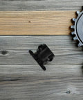 Durable Single Strand Roller Chain Sprocket With 9 Teeth And Carbon Steel High Load Capacity For Smooth Industrial Power Transmission And Reduced Noise Vibes on wooden background.