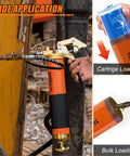 THINKWORK 8000 PSI grease gun kit with orange body and black pistol-grip handle on heavy machinery