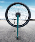 Must Have Wheel Truing Stand For 27.5 To 29 Inch Wheels, Heavy Duty High Carbon Steel Repair Tool displaying road bike wheel.